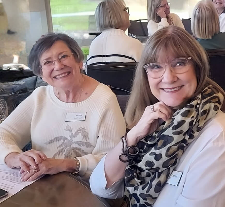 Two members smiling together at a Diablo Valley Giving Partners gathering